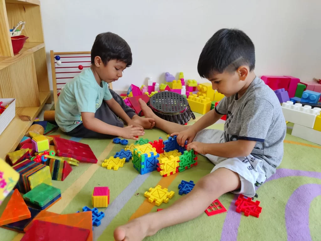 Two Toddlers play with each other at Sneha's Imagination