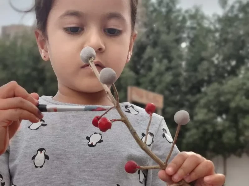 A Toddler Paint Tree Stick with Color Brush